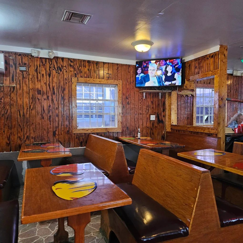 Restaurant interior with TV and wood walls